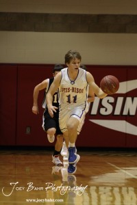 Otis-Bison Cougar Dylan Wissman (#11) pushes the ball up the court against the Ellsworth Bearcats during the 2012 Hoisington Winter Jam Basketball Tournament.
