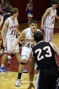 Otis-Bison Cougar Tyler Maier (#40) looks towards the Ellsworth Bearcats Ben Murrell (#23) during the 2012 Hoisington Winter Jam Basketball Tournament.