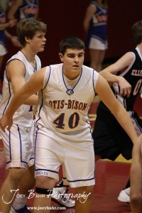 Otis-Bison Cougar Tyler Maier (#40) defends the basket against the Ellsworth Bearcats at the 2012 Hoisington Winter Jam Basketball Tournament.