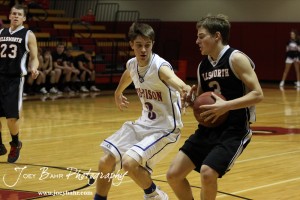 Otis-Bison Cougar Trevor Keller (#3) tries to slow down the Ellsworth Bearcats' Shane Wilson (#3) at the 2012 Hoisington Winter Jam Basketball Tournament.