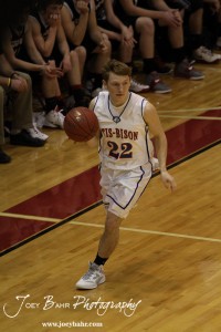Otis-Bison Cougar Patrick Piper (#22) drives the ball down the side of the court agains the Ellsworth Bearcats at the 2012 Hoisington Winter Jam Basketball Tournament.