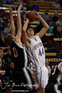 Otis-Bison Cougar Brandon Pechanec (#44) powers through the Ellsworth Bearcats' defense during the 2012 Hoisington Winter Jam Basketball Tournament.