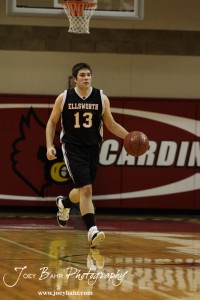 Ellsworth Bearcat McGregor Jones (#13) dribbles the ball down the court against the Otis-Bison Cougars at the 2012 Hoisington Winter Jam Basketball Tournament.