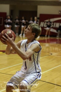 Otis-Bison Cougar Justus Bartonek (#1) looks to take a shot agains the Ellsworth Bearcats at the 2012 Hoisington Winter Jam Basketball Tournament.