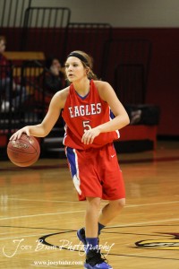 HWJ_Ellinwood_vs_Hoisington_Girls_1-20-12_0007 Jenna Snell (#5) of the Ellinwood Lady Eagles looks to pass the ball to a teammate against the Hoisington Lady Cardinals at the 2012 Hoisington Winter Jam Basketball Tournament.