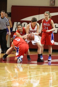 HWJ_Ellinwood_vs_Hoisington_Girls_1-20-12_0018 Hoisington Lady Cardinal Savannah Rose (#15) tries to pull the ball away from Kelsea Ward (#20) of the Ellinwood Lady Eagles at the 2012 Hoisington Winter Jam Basketball Tournament.