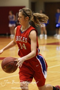 HWJ_Ellinwood_vs_Hoisington_Girls_1-20-12_0025 Brooke Panning (#14) of the Ellinwood Lady Eagles drives against the Hoisington Lady Cardinals at the 2012 Hoisington Winter Jam Basketball Tournament.
