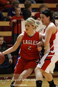 HWJ_Ellinwood_vs_Hoisington_Girls_1-20-12_0028 Sophie Hayes (#2) of the Ellinwood Lady Eagles drives past Hoisington Lady Cardinal BreAnna Burns (#5) at the 2012 Hoisington Winter Jam Basketball Tournament.