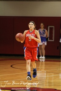 HWJ_Ellinwood_vs_Hoisington_Girls_1-20-12_0035 Jenna Snell (#5) of the Ellinwood Lady Eagles takes the ball down the court against the Hoisington Lady Cardinal at the 2012 Hoisington Winter Jam Basketball Tournament.