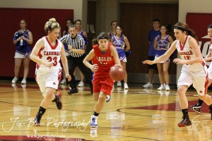 HWJ_Ellinwood_vs_Hoisington_Girls_1-20-12_0079 Bailey Schartz (#10) of the Ellinwood Lady Eagles drives through Hoisington Lady Cardinals Blakelee Cooper (#23) and Savannah Rose (#15) at the 2012 Hoisington Winter Jam Basketball Tournament.