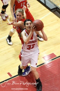 HWJ_Ellinwood_vs_Hoisington_Girls_1-20-12_0142 Mallory Flagor (#32) of the Hoisington Lady Cardinals goes up for a shot against the Ellinwood Lady Eagles at the 2012 Hoisington Winter Jam Basketball Tournament.