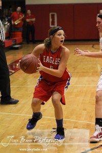 HWJ_Ellinwood_vs_Hoisington_Girls_1-20-12_0158 Ellinwood Lady Eagle Jenna Snell (#5) looks for a teammate to pass to against the Hoisington Lady Cardinals at the 2012 Hoisington Winter Jam Basketball Tournament.