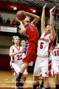 HWJ_Ellinwood_vs_Hoisington_Girls_1-20-12_0174 Sophie Hayes (#2) of the Ellinwood Lady Eagles takes a shot against the defense of BreAnna Burns (#5) of the Hoisington Lady Cardinals at the 2012 Hoisington Winter Jam Basketball Tournament.