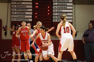 HWJ_Ellinwood_vs_Hoisington_Girls_1-20-12_0186 Mallory Flagor (#32) of the Hoisington Lady Cardinals drives through the Ellinwood Lady Eagles defense at the 2012 Hoisington Winter Jam Basketball Tournament.