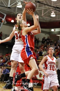 HWJ_Ellinwood_vs_Hoisington_Girls_1-20-12_0205 Hoisington Lady Cardinal Mallory Flagor (#32) blocks a shot by Ellinwood Lady Eagle Brooke Panning (#14) at the 2012 Hoisington Winter Jam Basketball Tournament.