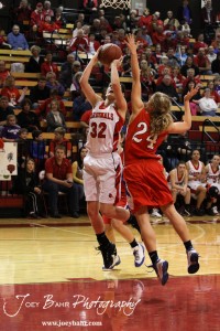 HWJ_Ellinwood_vs_Hoisington_Girls_1-20-12_0232 Hoisington Lady Cardinal Mallory Flagor (#32) goes up for a shot against Ellinwood Lady Eagle Lindsey Zink (#24) at the 2012 Hoisington Winter Jam Basketball Tournament.