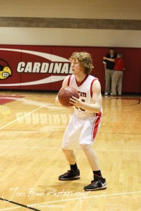 Ellsworth Bearcat Clint Glaser (#15) looks to pass the ball to a teammate against the Victoria Knights at the 2012 Hoisington Winter Jam Basketball Tournament.