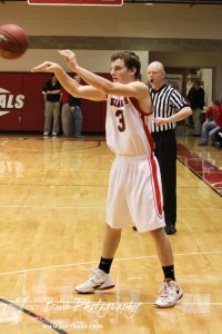 Shane Wilson (#3) of the Ellsworth Bearcats passes the ball to a teammate against the Victoria Knights at the 2012 Hoisington Winter Jam Basketball Tournament.