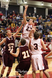 Ben Murrell (#23) of the Ellsworth Bearcats takes a shot over the Victoria Knights defense at the 2012 Hoisington Winter Jam Basketball Tournament.