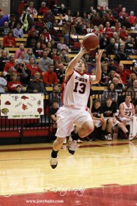 McGregor Jones (#13) goes up for a layup against the Victoria Knights at the 2012 Hoisington Winter Jam Basketball Tournament.