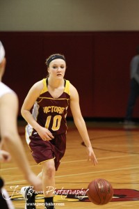 Victoria Lady Knight Kristin Huser (#10) dribbles the ball down the court against the Ellsworth Lady Bearcats at the 2012 Hoisington Winter Jam.