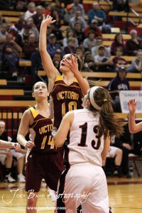 Victoria Lady Knight Kristin Huser (#10) takes a shot over Ellsworth Lady Bearcat Maycee Jones (#13) at the 2012 Hoisington Winter Jam.