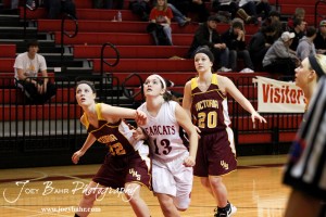 Victoria Lady Knight Kaley Goetz (#22) blocks out Ellsworth Lady Bearcat Maycee Jones (#13) during a free throw attempt at the 2012 Hoisington Winter Jam Basketball Tournament.