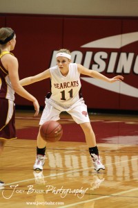 Ellsworth Lady Bearcats' Brenn Cravens (#11) defends against the Victoria Lady Knights at the 2012 Hoisington Winter Jam Basketball Tournament.