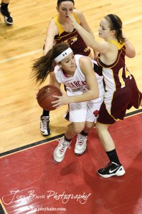 Connor Davis (#20) drives against the defense of the Victoria Lady Knights at the 2012 Hoisington Winter Jam.