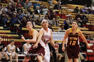 Kaley Goetz (#22) of the Victoria Lady Knights blocks out Ellsworth Lady Bearcat Connor Davis (#20) during a free throw attempt at the 2012 Hoisington Winter Jam Basketball Tournament.