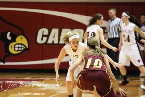 Ellsworth Lady Bearcat Rachel Herzog (#5) stares down Victoria Lady Knights point guard Kristin Huser (#10) at the 2012 Hoisington Winter Jam Basketball Tournament.