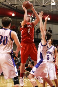 Cody Stetler (#4) of the Hoisington Cardinals goes up for a shot against the Minneapolis Lions at the 2012 Hoisington Winter Jam Basketball Tournament.