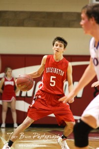 Hoisington Cardinal Ryan Becker (#5) prepares to drive into the Minneapolis Lions defense at the 2012 Hoisington Winter Jam Basketball Tournament.