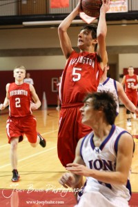 Hoisington Cardinal Ryan Becker (#5) goes up for a layup against the Minneapolis Lions at the 2012 Hoisington Winter Jam Basketball Tournament.