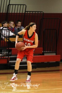 Jordin Greer (#10) of the Hoisington Lady Cardinals looks to make a pass to a teammate against the Russell Lady Broncos at the 2012 Hoisington Winter Jam Basketball Tournament.