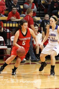 Hoisington Lady Cardinal BreAnna Burns (#5) takes the ball over in the Russell Lady Broncos end at the 2012 Hoisington Winter Jam Basketball Tournament.