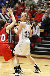 Russell Lady Bronco Janna Schulte (#32) looks to make a pass against the Hoisington Lady Cardinals at the 2012 Hoisington Winter Jam Basketball Tournament.