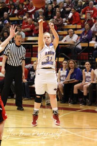 Tori Ptacek (#31) of the Russell Lady Broncos takes a shot against the Hoisington Lady Cardinals at the 2012 Hoisington Winter Jam Basketball Tournament.