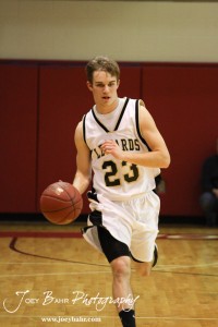 LaCrosse Leopard Austin Webs (#23) carries the ball down the court against the Ellinwood Eagles at the 2012 Hoisington Winter Jam Basketball Tournament.