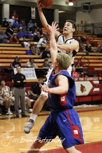 LaCrosse Leopard Kip Keeley (#24) goes up for a layup against the Ellinwood Eagles at the 2012 Hoisington Winter Jam Basketball Tournament.