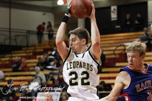 LaCrosse Leopard Tayler Stull (#22) pulls down a rebound against the Ellinwood Eagles at the 2012 Hoisington Winter Jam Basketball Tournament.