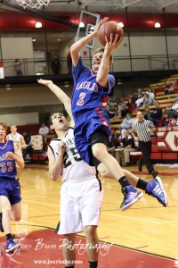 Patrick Ringering (#2) of the Ellinwood Eagles goes up for a layup against the LaCrosse Leopards at the 2012 Hoisington Winter Jam Basketball Tournament.
