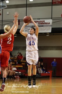 Janel Tammen (#45) of the Otis-Bison Lady Cougars takes a shot against Ellinwood Lady Eagle Sophie Hayes (#2) at the 2012 Hoisington Winter Jam Basketball Tournament.