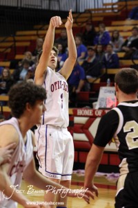 Otis-Bison Cougar Trevor Keller (#3) takes a shot against the LaCrosse Leopards at the 2012 Hoisington Winter Jam Basketball Tournament.