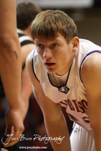 Patrick Piper (#22) of the Otis-Bison Cougars waits for the ball to be thrown in against the LaCrosse Leopards at the 2012 Hoisington Winter Jam Basketball Tournament.