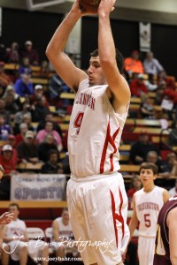 Hoisington Cardinal Cody Stetler (#4) goes up with the ball against the Victoria Knights at the 2012 Hoisington Winter Jam Basketball Tournament.
