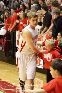Anthony Broeder (#22) of the Hoisington Cardinals greets fans before the start of the game against the Ellinwood Eagles at the Hoisington Activities Center in Hoisington, Kansas on February 10, 2012.  Photo: Joey Bahr