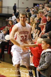 Hoisington Cardinal Derrick Kaiser (#32) greets fans before the start of the game against the Ellinwood Eagles at the Hoisington Activities Center in Hoisington, Kansas on February 10, 2012.  Photo: Joey Bahr