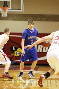 Ellinwood Eagle Patrick Ringering (#2) prepares to drive against the Hoisington Cardinal defense at the Hoisington Activities Center in Hoisington, Kansas on February 10, 2012.  Photo: Joey Bahr