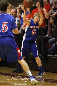 Gavin Vink (#5) of the Ellinwood Eagles throws in the basketball against the Hoisington Cardinals at the Hoisington Activities Center in Hoisington, Kansas on February 10, 2012.  Photo: Joey Bahr